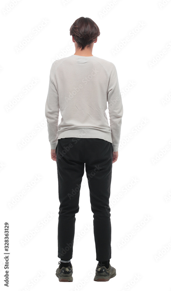 rear view. stylish young man looking at blank white wall. rear view. stylish young man looking at blank white wall.