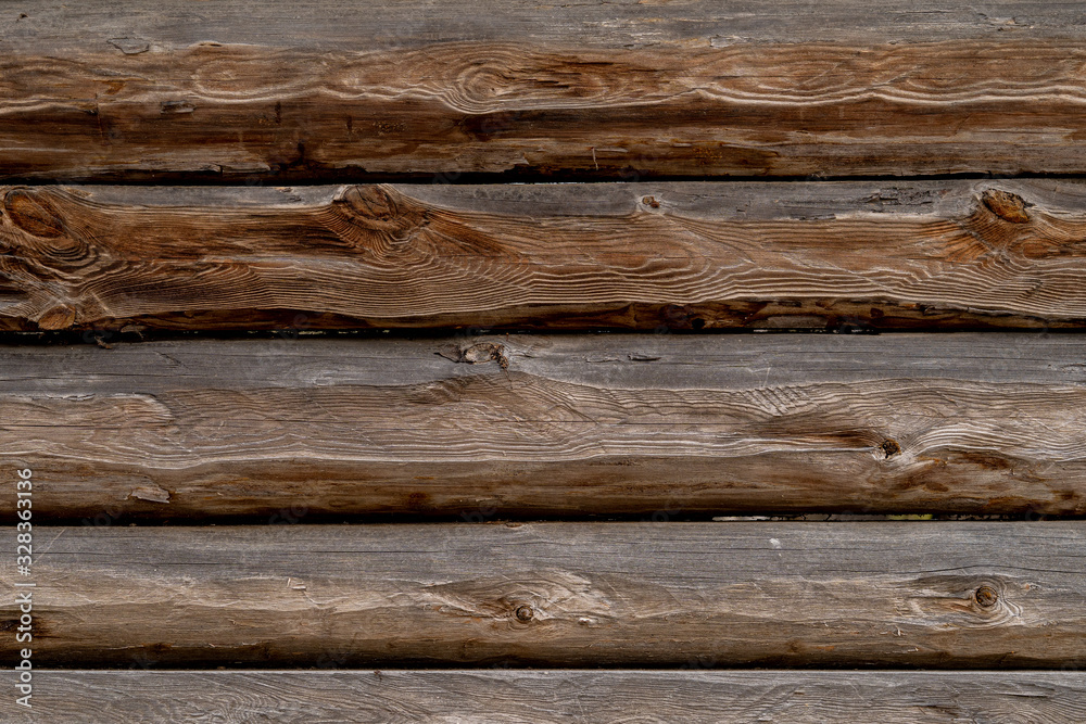 Naklejka premium Texture od wooden planks. Wall made of antique wood. Raw wood after century.