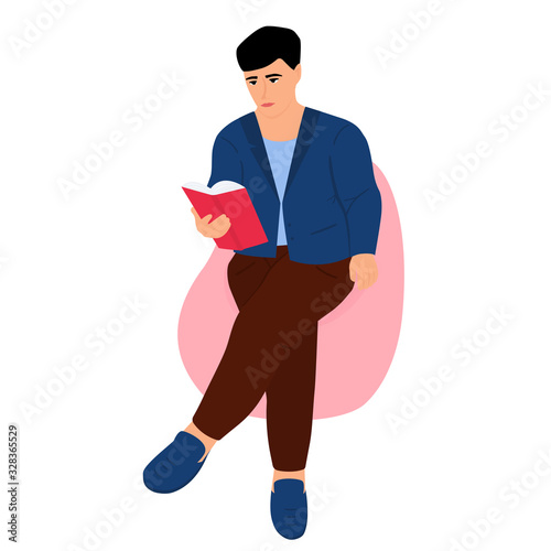 A young man sits in a chair bag and reads a paper book. Student preparing for the exam. Literature fans. Love reading.