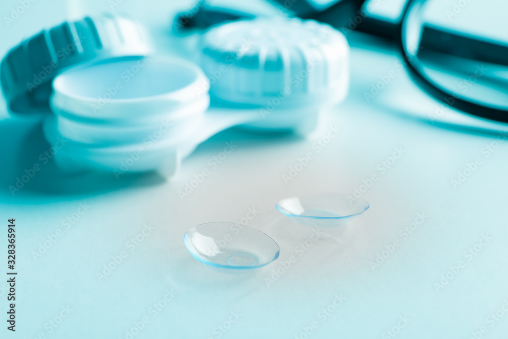 Glasses, contact lenses and case on white background, close up Glasses, contact lenses and case on white background, close up