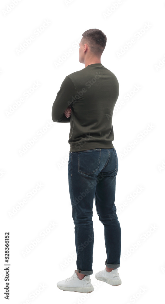 side view. serious young man looking at blank white screen . side view. serious young man looking at blank white screen .