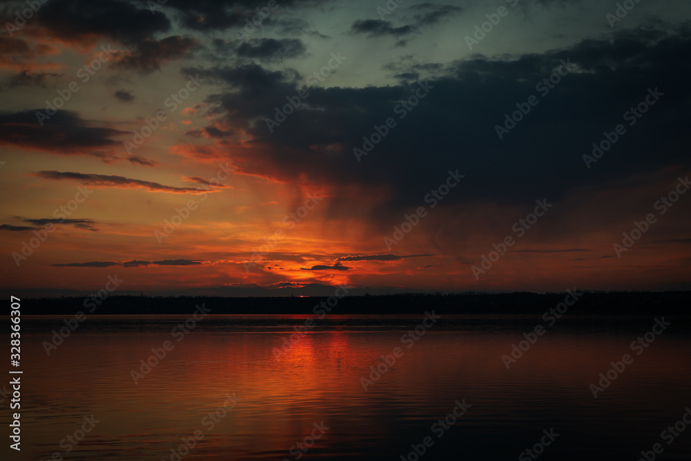 Amazing sunset with clouds and river. Nature background