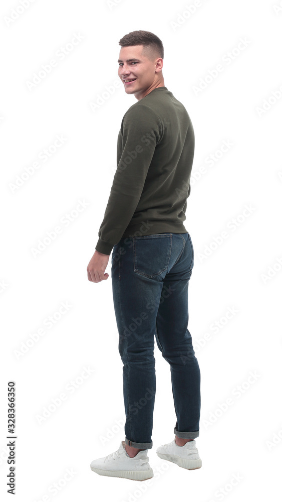 side view. serious young man looking at blank white screen . side view. serious young man looking at blank white screen .