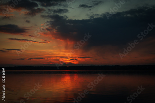 Amazing sunset with clouds and river. Nature background