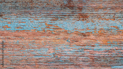 Background, old wooden texture, board with peeling blue paint_