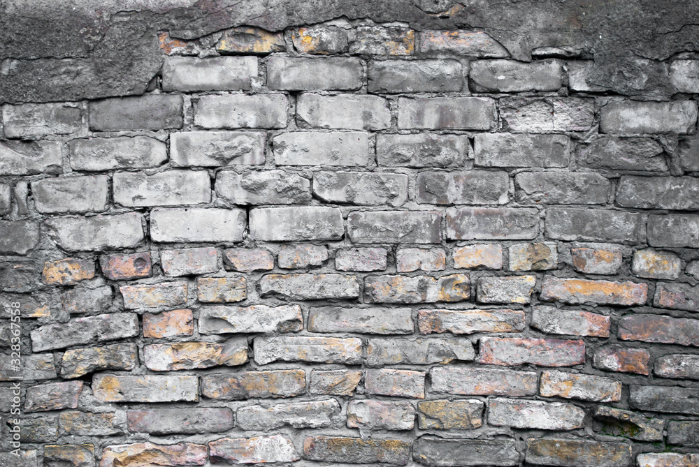 old grey-yellow brick wall and plaster old grey-yellow brick wall and plaster