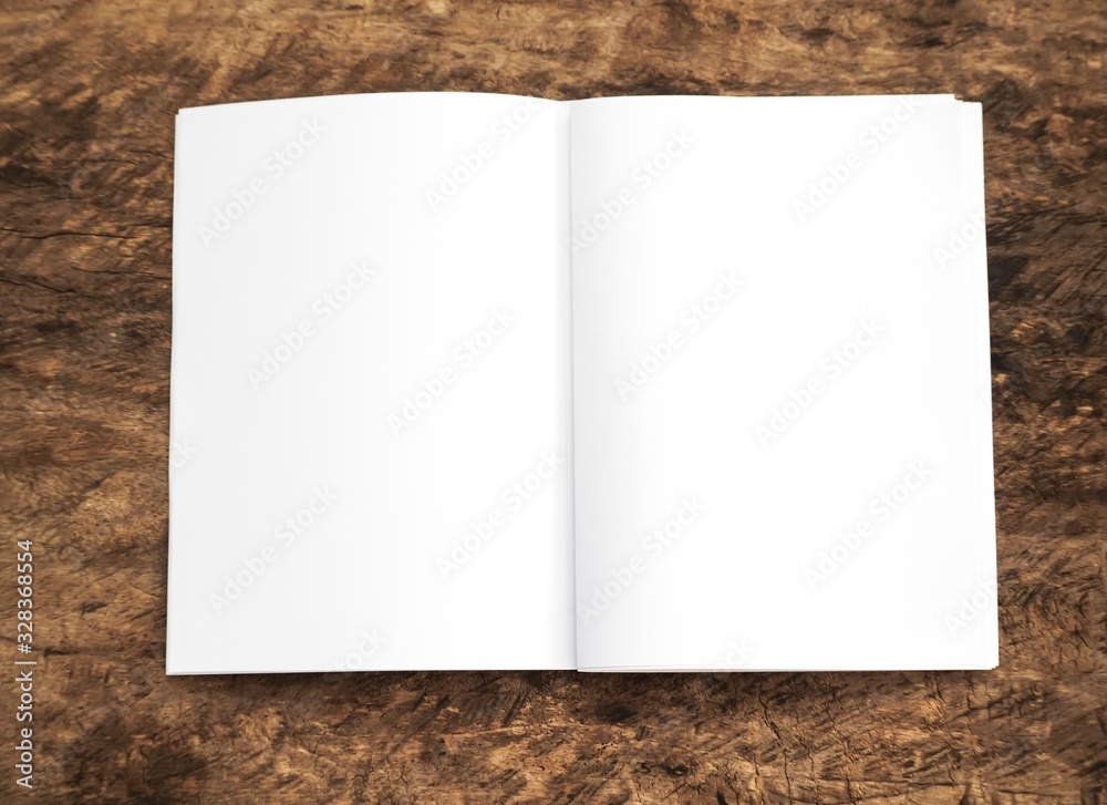 Blank portrait. white paper isolated on wood background. Poster mock-ups paper, identity design, set of booklets, blank white folding paper, brochure magazine, use newspapers banners products business Blank portrait. white paper isolated on wood background. Poster mock-ups paper, identity design, set of booklets, blank white folding paper, brochure magazine, use newspapers banners products business