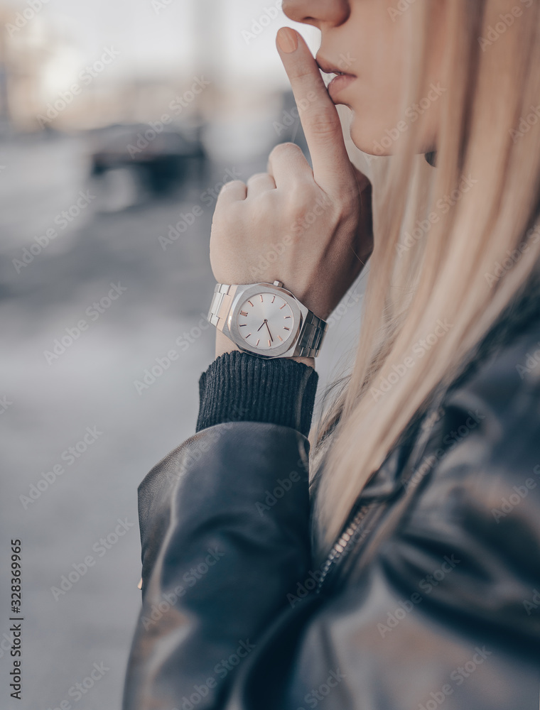 Stylish fashion silver watch on woman hand