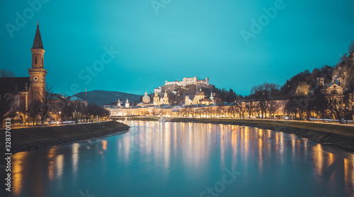 Salzburg old city at dusk: Salzach, fortress Hohensalzburg and Cathedral