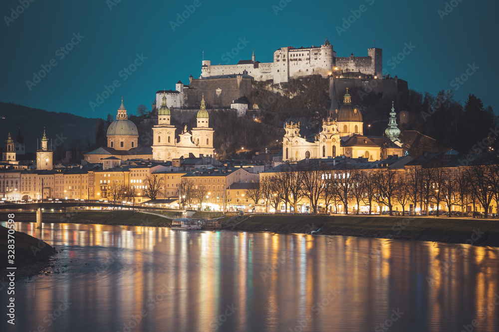 Salzburg old city at dusk: Salzach, fortress Hohensalzburg and Cathedral