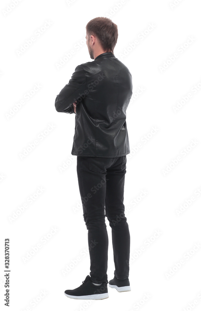 rear view. confident young man looking at white blank screen rear view. confident young man looking at white blank screen