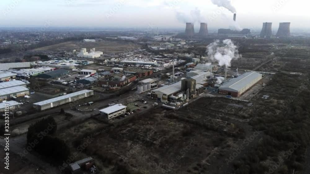 Aerial pull away view British canal town industry factory facility with railway tracks Aerial pull away view British canal town industry factory facility with railway tracks