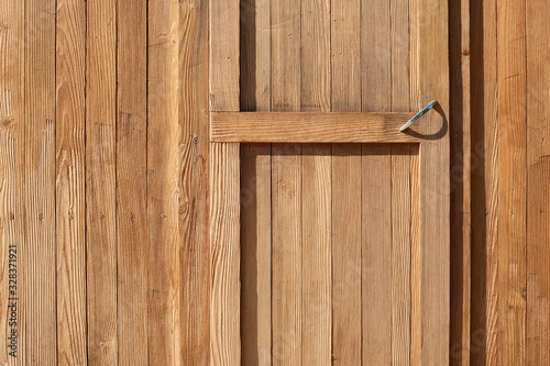 Door of the light wooden garden shed.