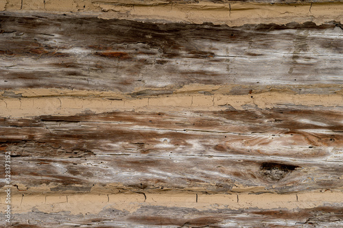 Texture od wooden planks. Wall made of antique wood. Raw wood after century.