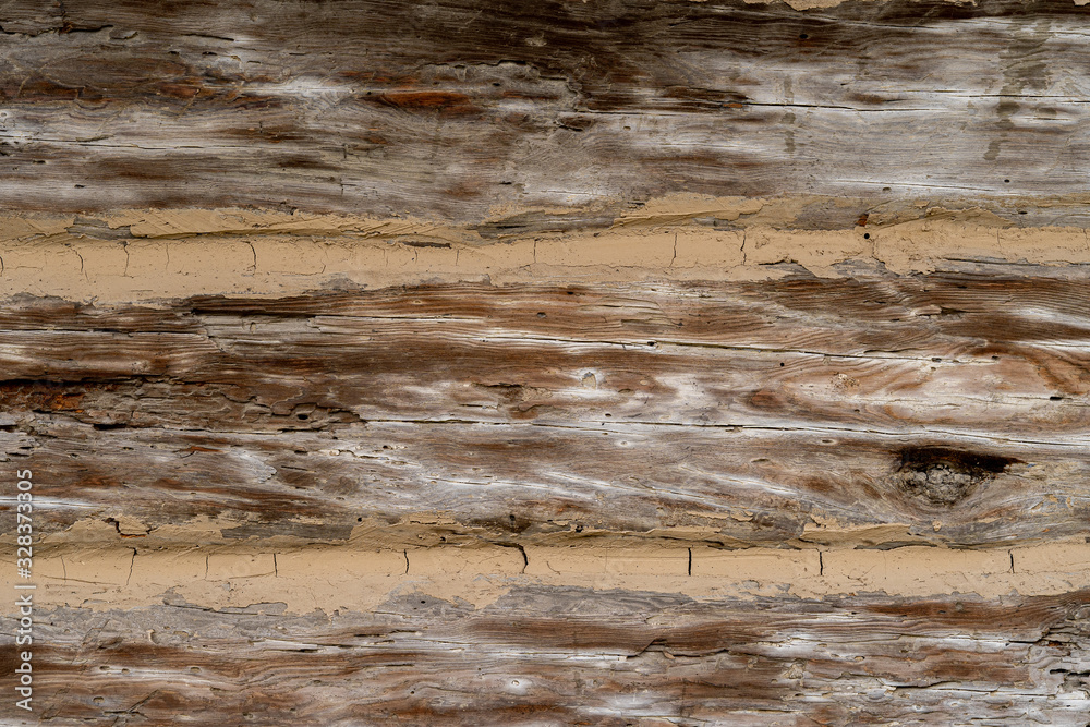 Naklejka premium Texture od wooden planks. Wall made of antique wood. Raw wood after century.