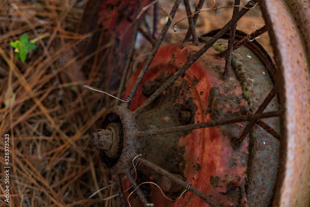 Red old wheel and rusty spokes close-up Red old wheel and rusty spokes close-up
