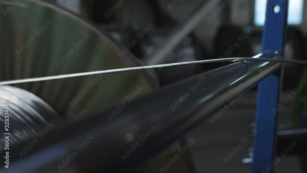 Electric cable production. Aluminum wire is wound on a large. the coil at the factory. Electric cable production. Aluminum wire is wound on a large. the coil at the factory.