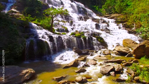 Aerial Shot Beautiful waterfall in the mountain. photo