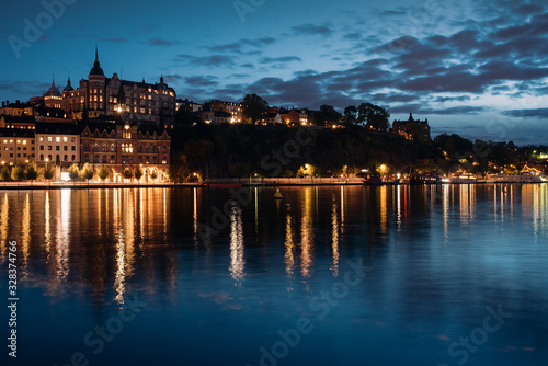 View of Sodermalm with illuminated historical buildings during the night in Stockholm, Sweden.