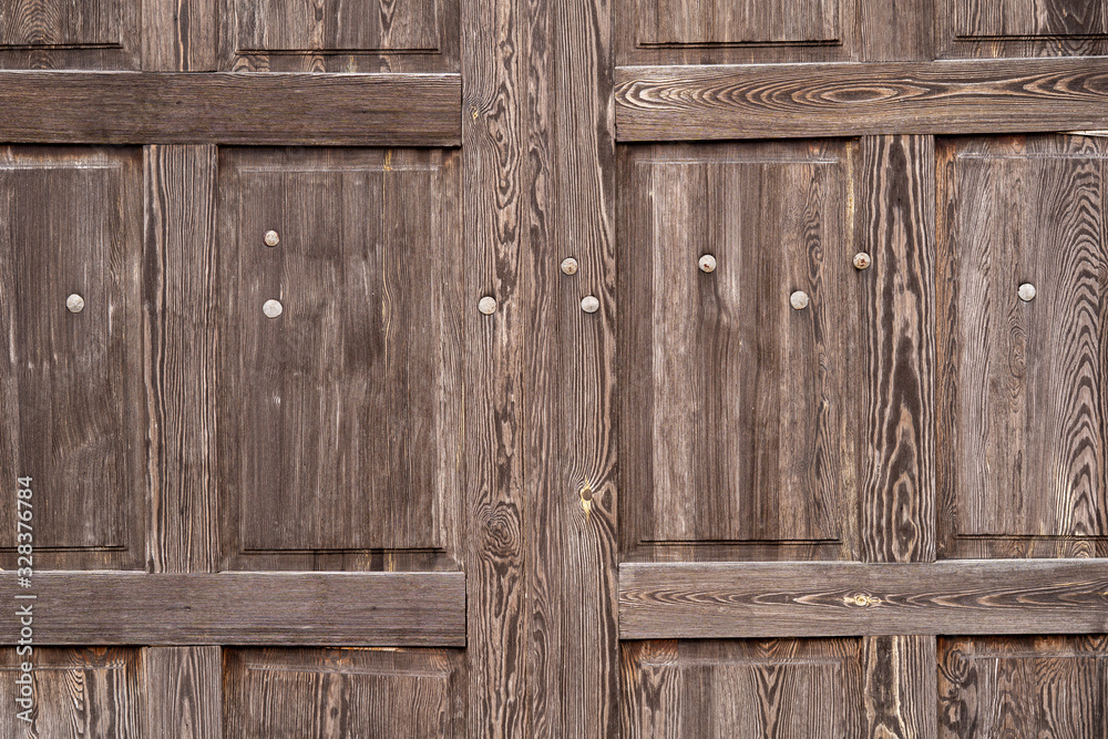 Texture od wooden door made of old wood. Raw wood after years. Texture od wooden door made of old wood. Raw wood after years.