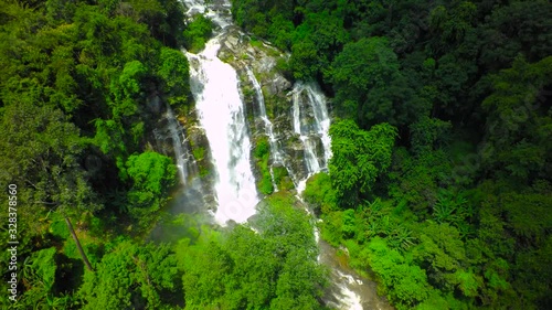 Aerial Shot Beautiful waterfall in the mountain. photo