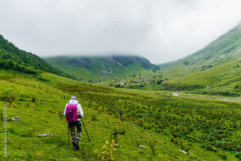 tourists with backpacks travel in the caucasus mountains tourists with backpacks travel in the caucasus mountains