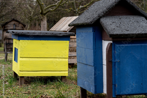 Vintage wooden beehives in the garden.  © ABCreative