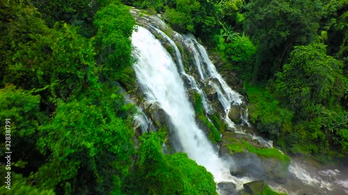 Aerial Shot Beautiful waterfall in the mountain. photo