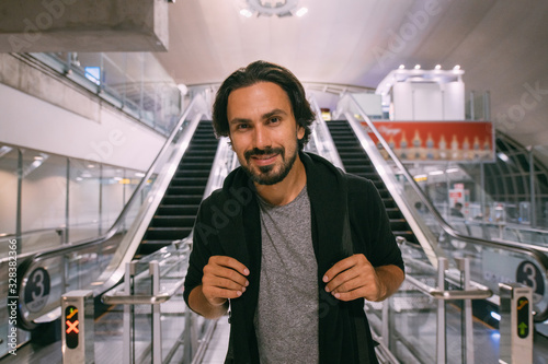 A man near the escalator at the airport