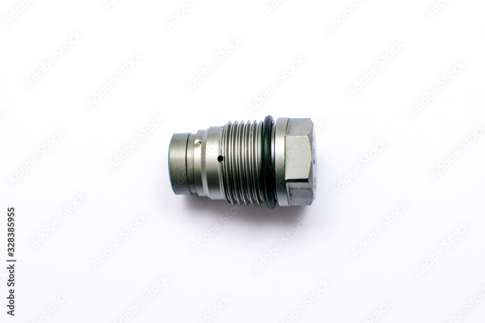 The pressure-limiting valve the fuel rail isolated on white background. The pressure-limiting valve the fuel rail isolated on white background.