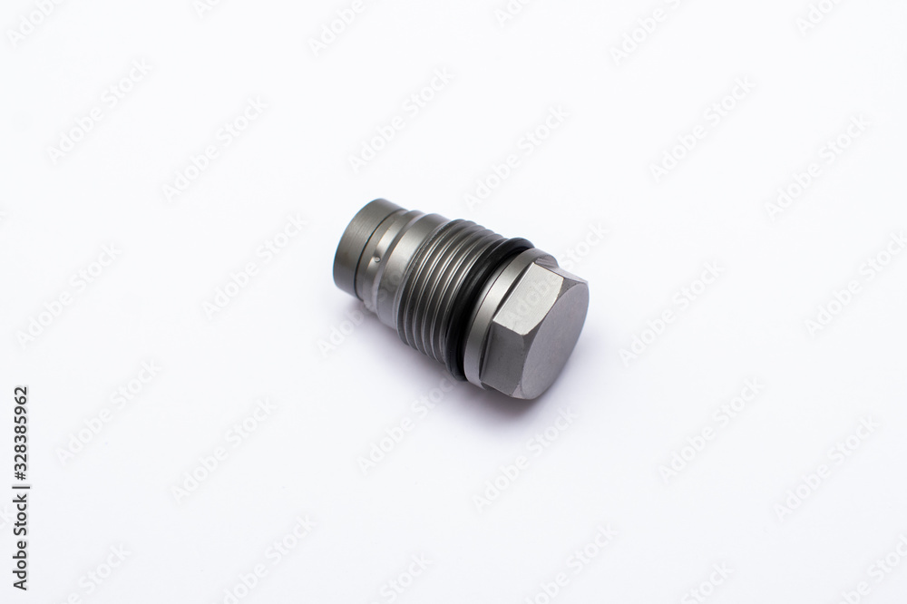 The pressure-limiting valve the fuel rail isolated on white background. The pressure-limiting valve the fuel rail isolated on white background.