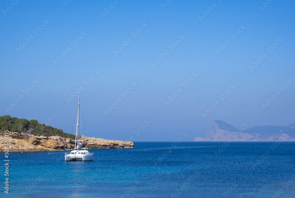 Sailboat docked at Cala Bassa, Ibiza, Balearic Islands Sailboat docked at Cala Bassa, Ibiza, Balearic Islands