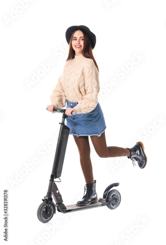 Young woman with kick scoot...