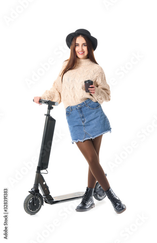 Young woman with kick scoot...