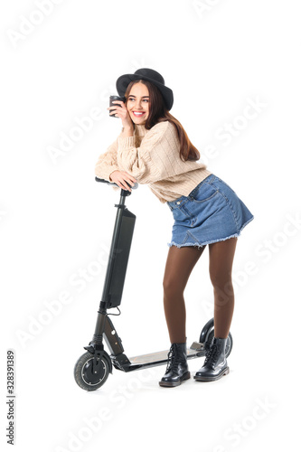 Young woman with kick scoot...