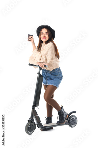 Young woman with kick scoot...