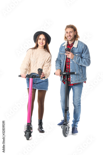 Young couple with kick scoo...