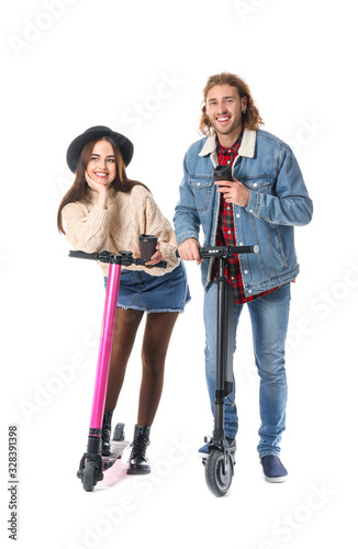 Young couple with kick scoo...