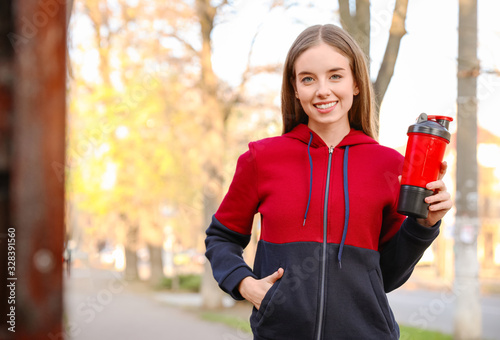 Young sporty woman with pro...