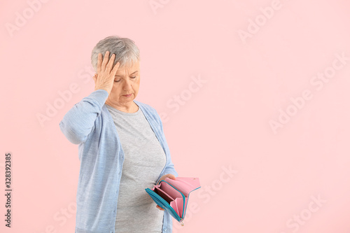 Senior woman with empty wal...