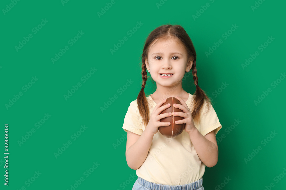Cute little girl with sweet chocolate egg on color background Cute little girl with sweet chocolate egg on color background