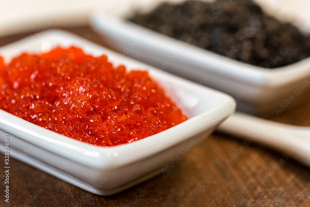 Black sturgeon and red salmon caviar close up Black sturgeon and red salmon caviar close up