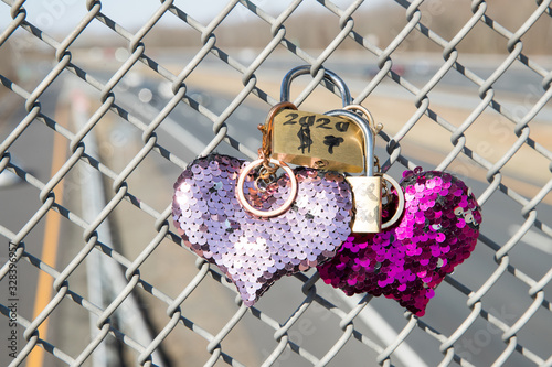 Locked padlock on the fence - Image