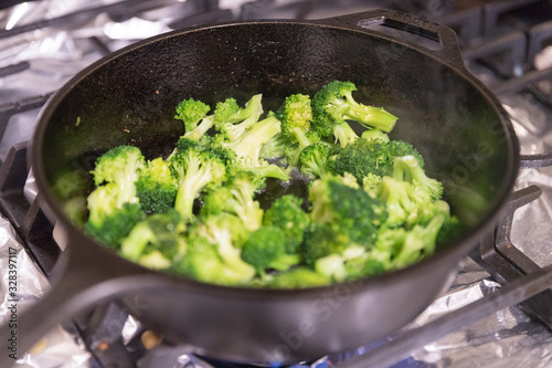 broccoli. frying in a pan. - Image