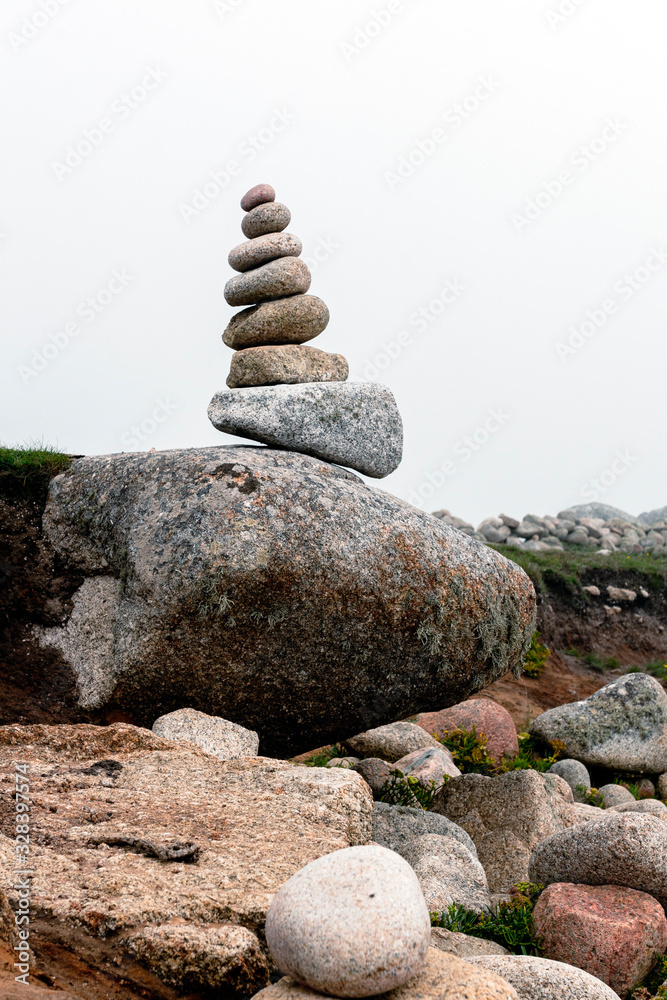 Stones balanced on a pebble beach, Isles of Scilly Stones balanced on a pebble beach, Isles of Scilly