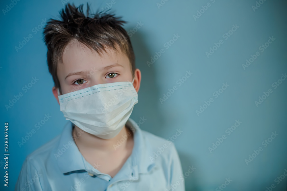 10 years old boy in medicine healthcare mask on blue background.