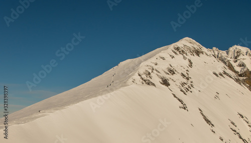 Beautiful panoramic view of snow-capped mountains in the Swiss Alps.