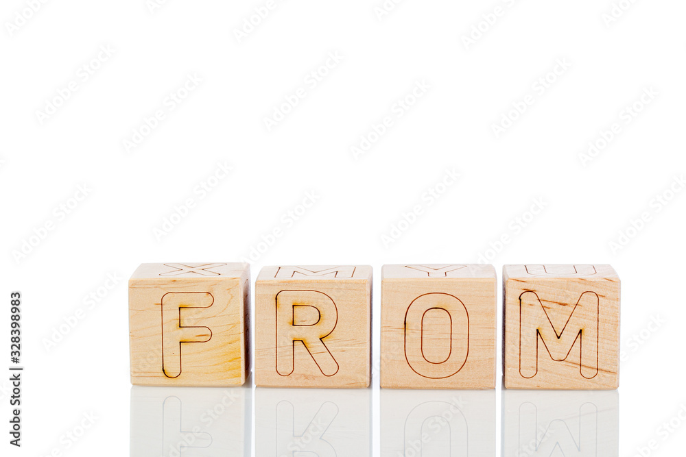Wooden cubes with letters from on a white background