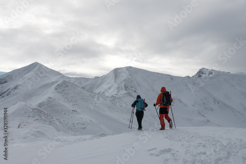 hiker with a backpack in the winter in the mountains © roobcio