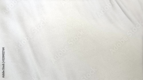 white flag cloth in full frame with selective focus. Seamlessly looping 3D animation of slight off white garment with clean natural linen texture for background banner or wallpaper use.
